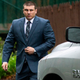 New York City cop Daniel Pantaleo leaves his house May 13, 2019, in Staten Island, N.Y., as his long-delayed disciplinary trial in the death of Eric Garner is set to begin.